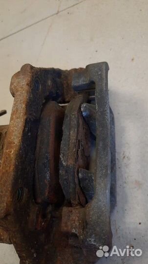 Суппорт тормозной задний левый Ford Edge