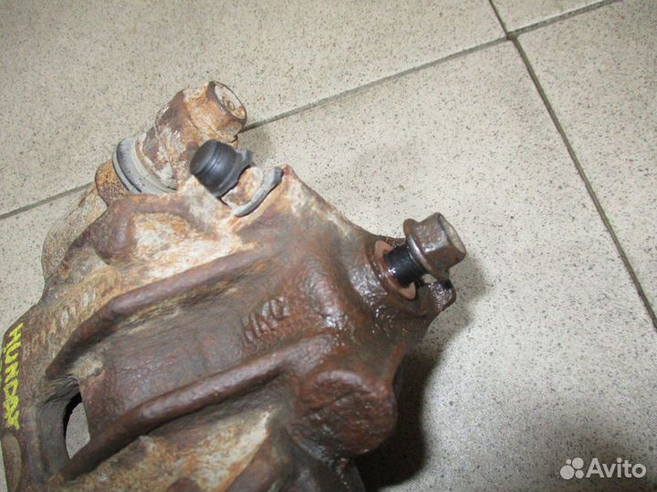 Суппорт задний левый Hyundai i20 (PB)