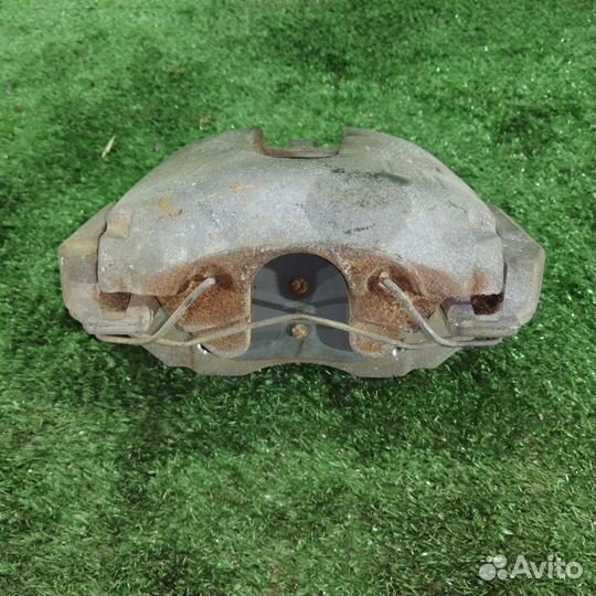 Суппорт тормозной передний левый Mazda Axela bkep