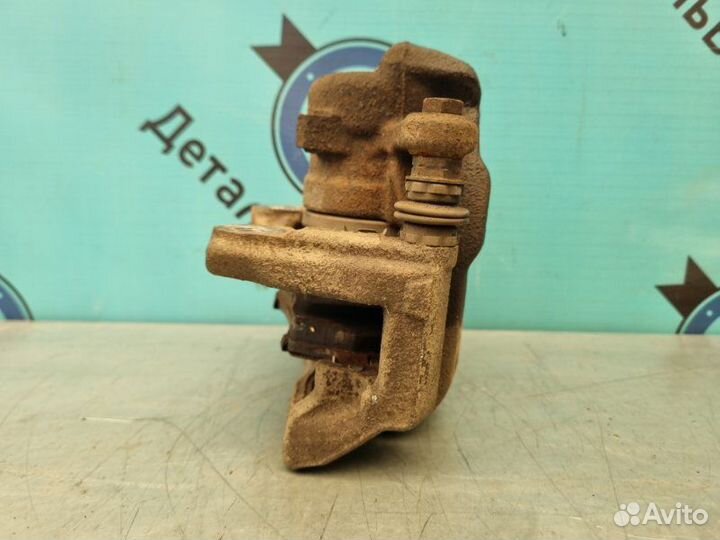 Суппорт тормозной передний левый Nissan Almera G15