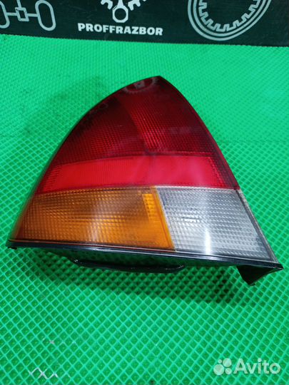Фонарь задний в крыло левый mitsubishi carisma 199