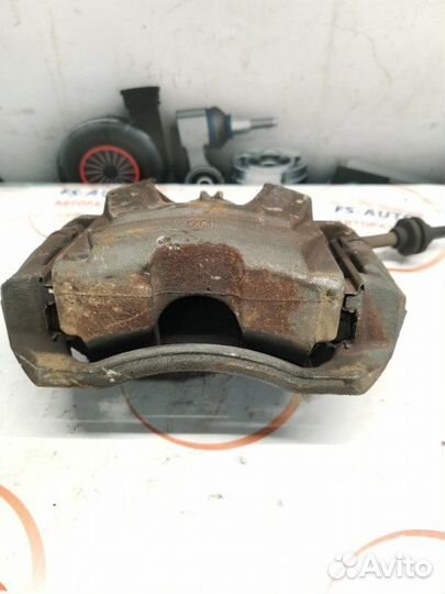 Суппорт тормозной передний левый Opel Astra J