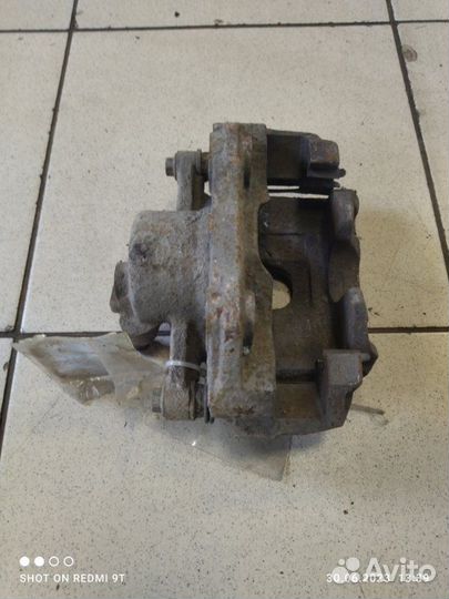 Суппорт тормозной передний левый Volkswagen Polo