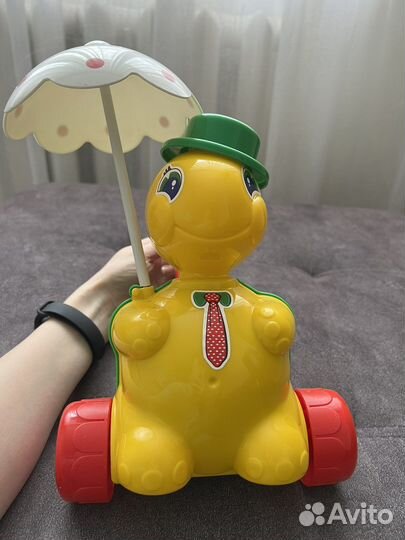 Игрушка каталка с ручкой