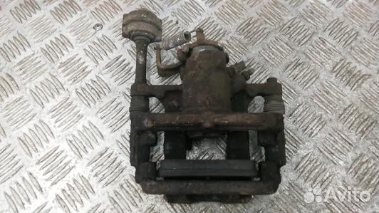 Суппорт тормозной задний левый opel astra J (LEA12