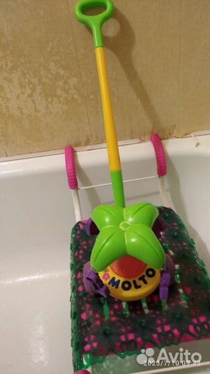 Игрушка каталка с ручкой