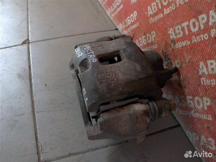 Суппорт тормозной передний левый Kia Spectra