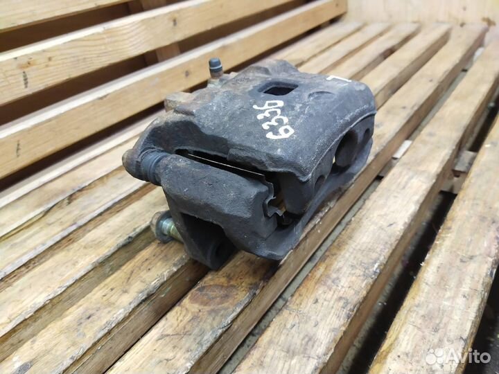 Суппорт тормозной передний левый Nissan Teana J31