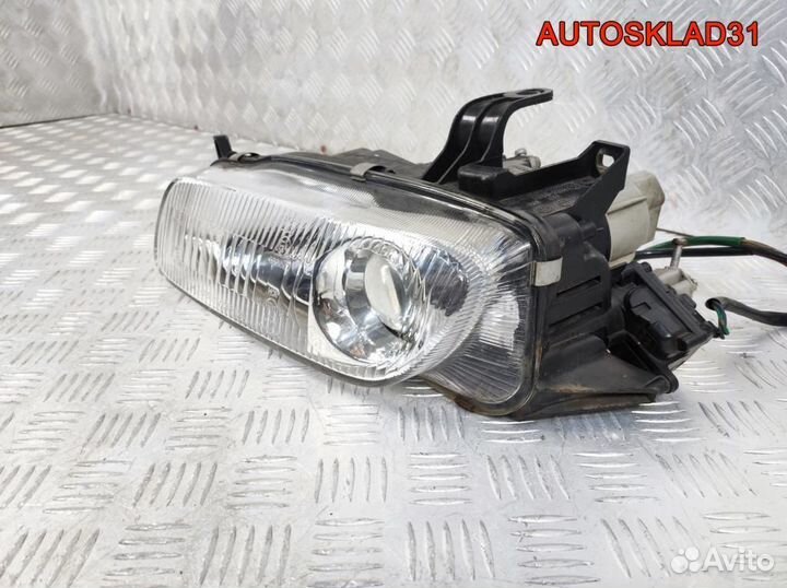 Фара левая Mazda 323 BA 2161128L