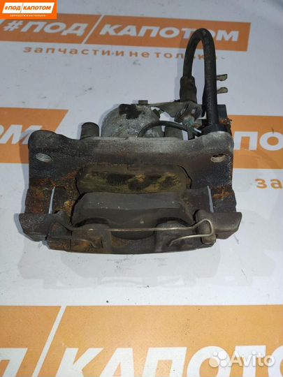 Суппорт тормозной передний левый Volkswagen Passat