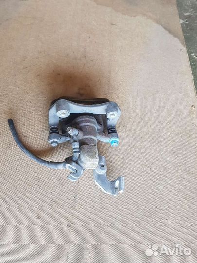 Суппорт тормозной задний правый Мазда 6GH