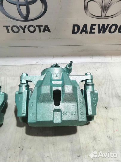 Суппорт тормозной передний Toyota Auris NZE151