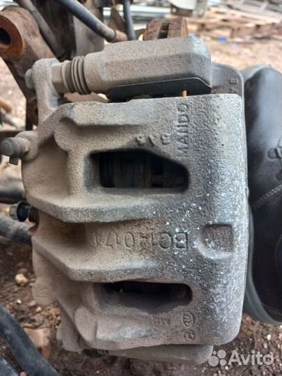 Суппорт передний правый Hyundai Santa Fe 3