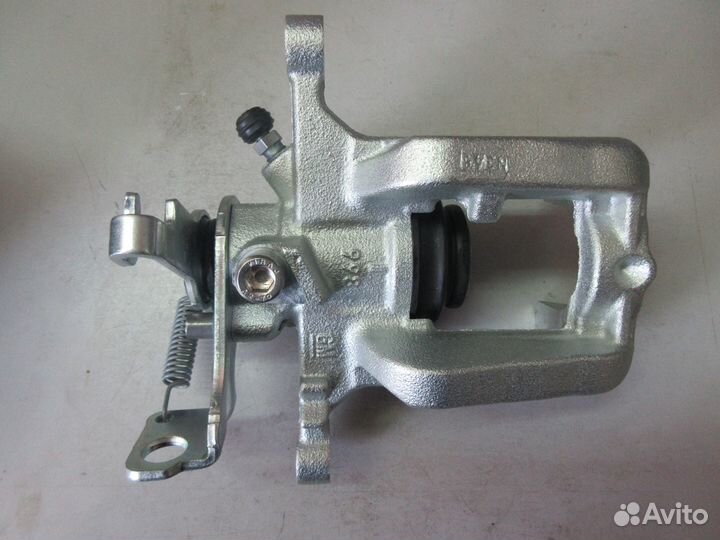 Суппорт задний тормозной правый Astra J