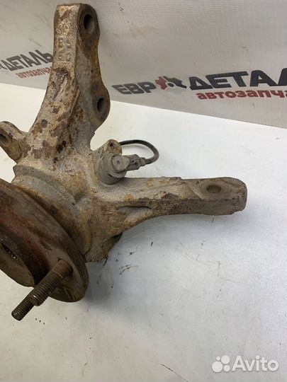 Кулак поворотный передний левый Mitsubishi Lancer