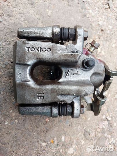 Суппорт задний левый Toyota corolla E 150