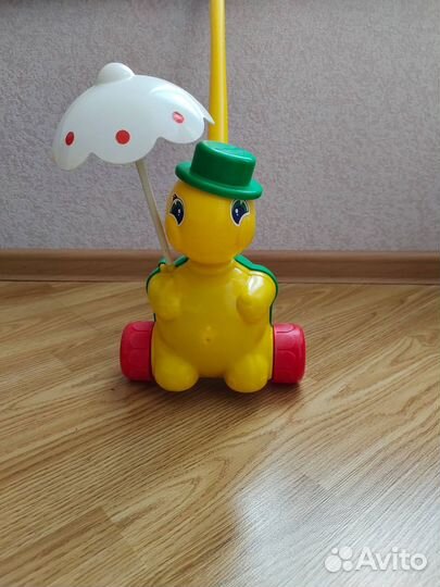 Игрушка каталка с ручкой