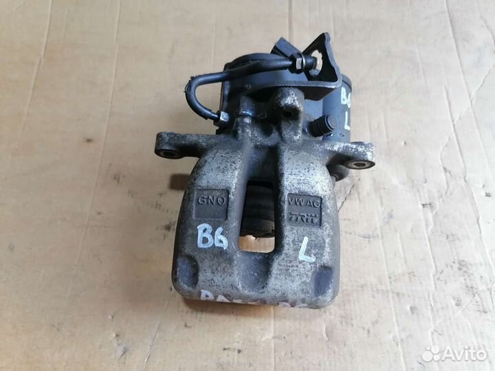 Суппорт задний левый VW Passat B6