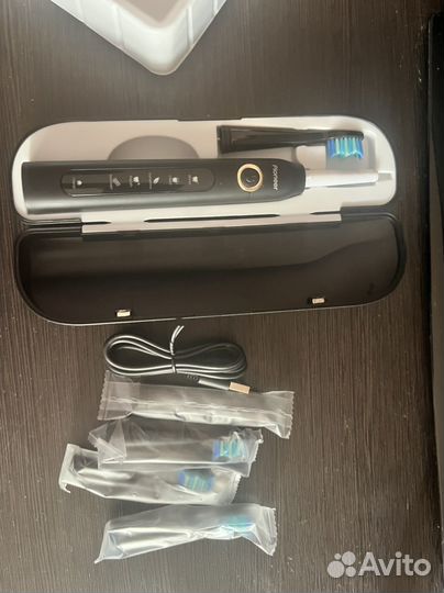 Электрическая зубная щетка