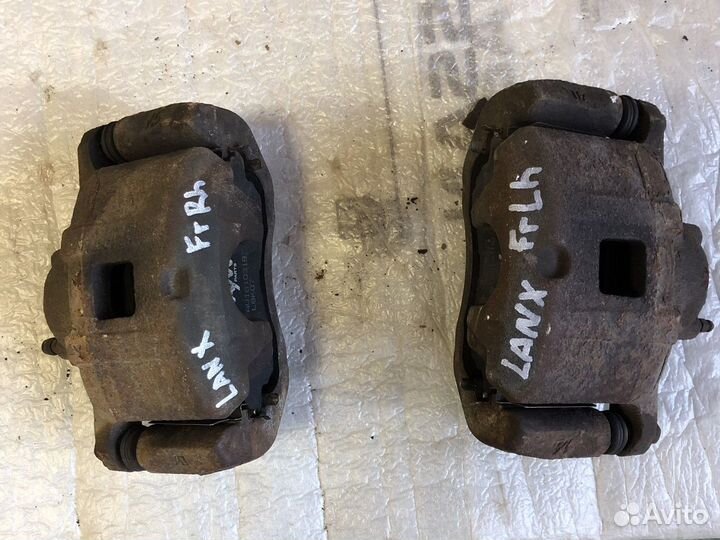 Суппорт тормозной передний Mitsubishi Lancer 10