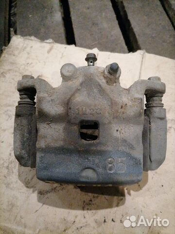 Суппорт тормозной передний левый Nissan Teana