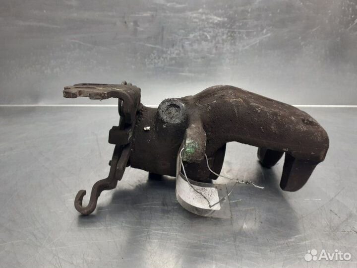 Суппорт тормозной задний левый Volkswagen Caddy