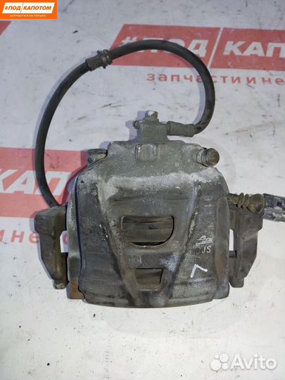 Суппорт тормозной передний левый Volkswagen Tiguan