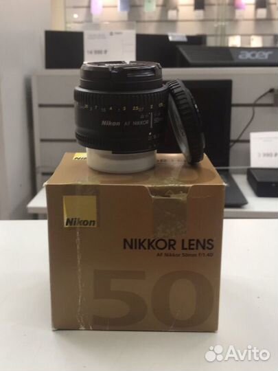 А5) Объектив Nikom AF