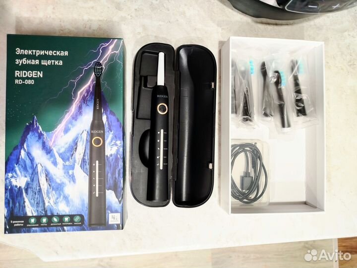 Электрическая зубная щетка