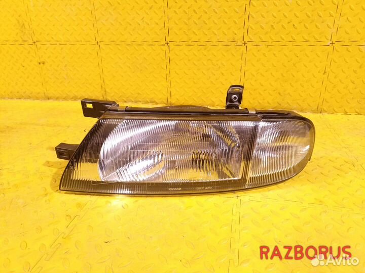 Фара левая Nissan Bluebird U13 93-97 Рест Оригинал