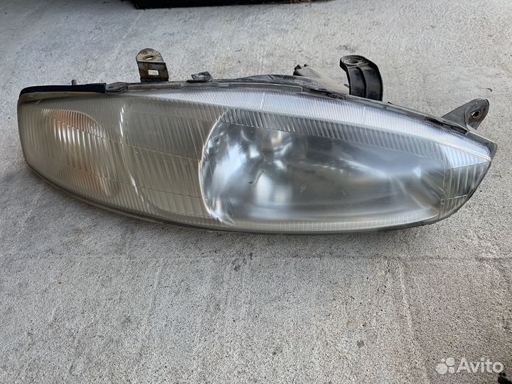 Фары передние Mitsubishi Colt CJ