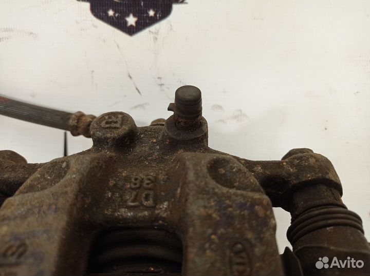 Суппорт тормозной задний правый R Hyundai Tucson