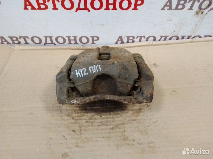 Суппорт тормозной передний правый Nissan Micra K12