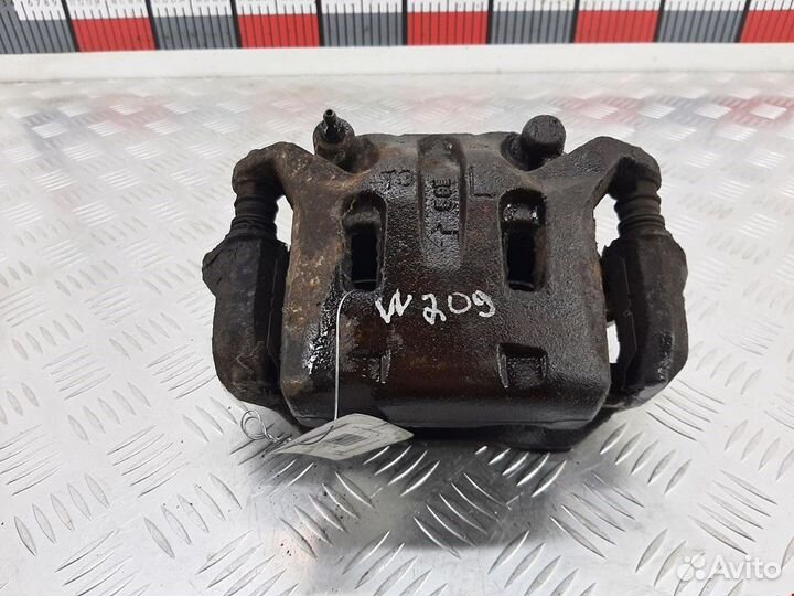 Суппорт передний левый Nissan Navara D22 рест