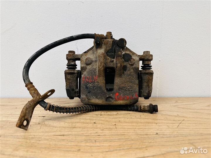 Суппорт тормозной передний левый Kia Cerato 2 1.6