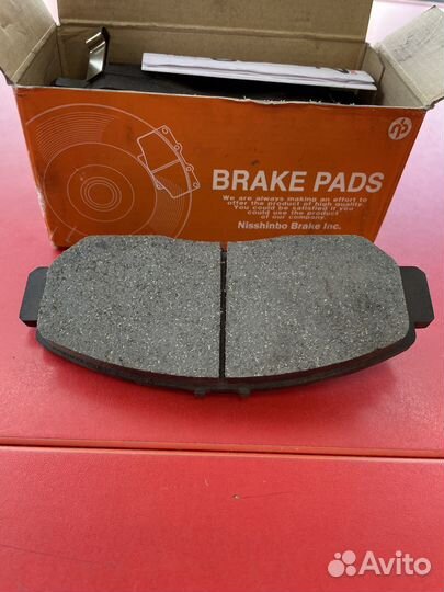 Колодки тормозные дисковые передние Nisshinbo