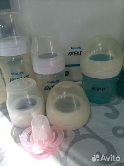 Бутылочки для кормления и стерилизатор