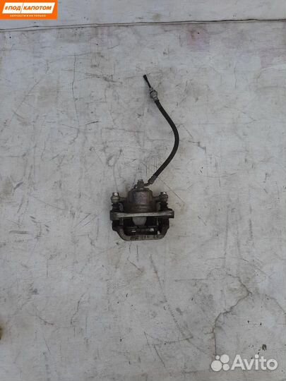 Суппорт тормозной задний левый Nissan Teana J32