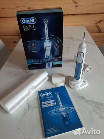 Электрическая зубная щетка oral b