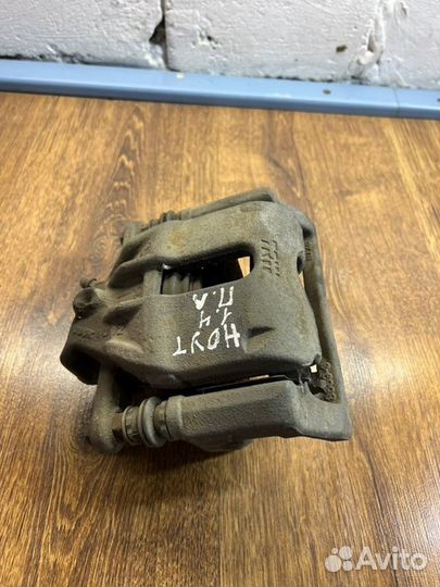 Суппорт тормозной передний левый Nissan Note