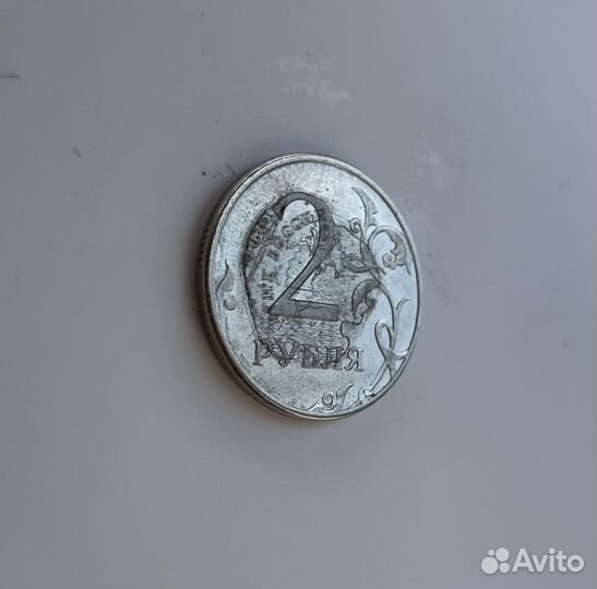 Монета с браком. Орел прочеканен поверх решки