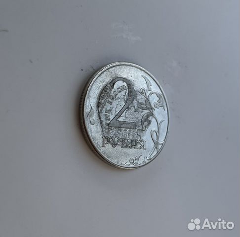 Монета с браком. Орел прочеканен поверх решки