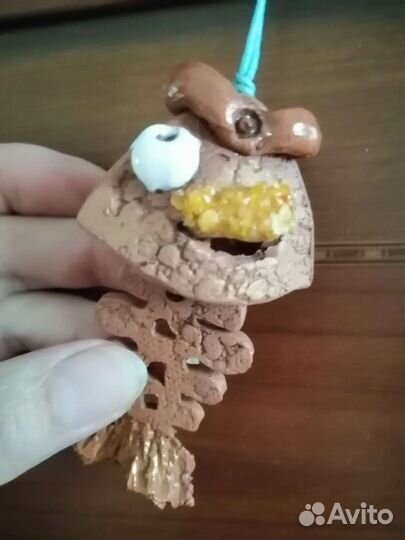 Глинянный колокольчик в виде острова рыбки