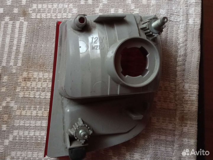 Фонарь левый задний противотуманный Тлк 200