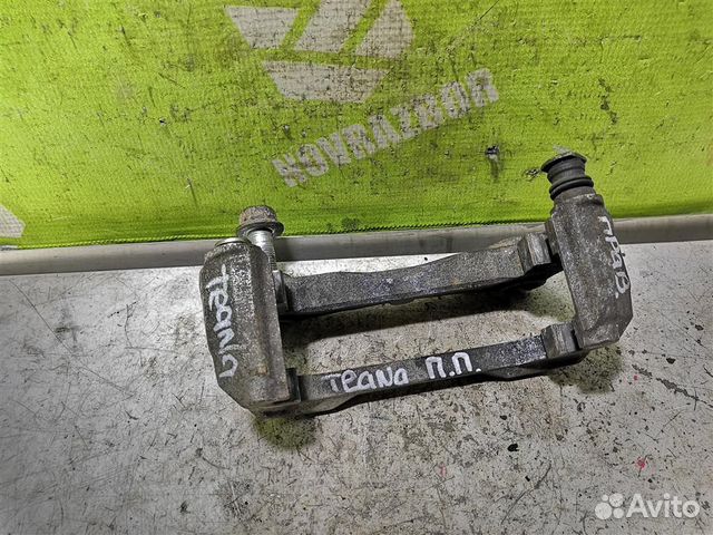 Скоба суппорта переднего Ниссан Теана