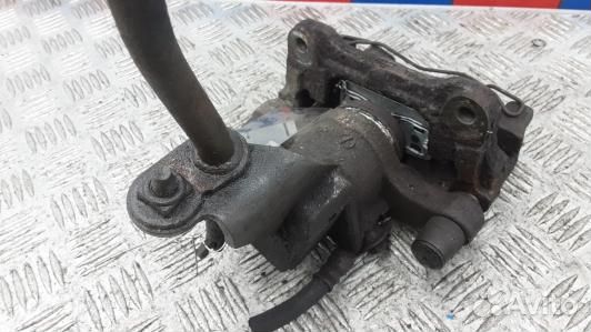 Суппорт тормозной задний левый nissan primera P12