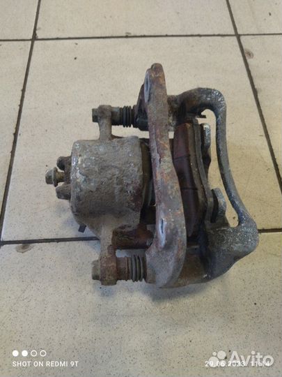 Суппорт тормозной передний левый Kia Rio 4