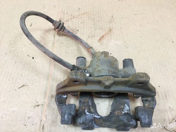 Суппорт тормозной передний левый Renault Logan 2