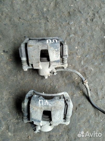 Суппорт тормозной Шевроле Лачетти передний