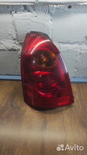 Фонарь заднего хода задний левый Nissan Primera P